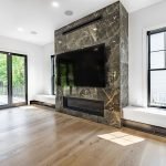 Custom Design and Build Living Room with Fireplace, Wall Benches, and Large Wall-mounted TV
