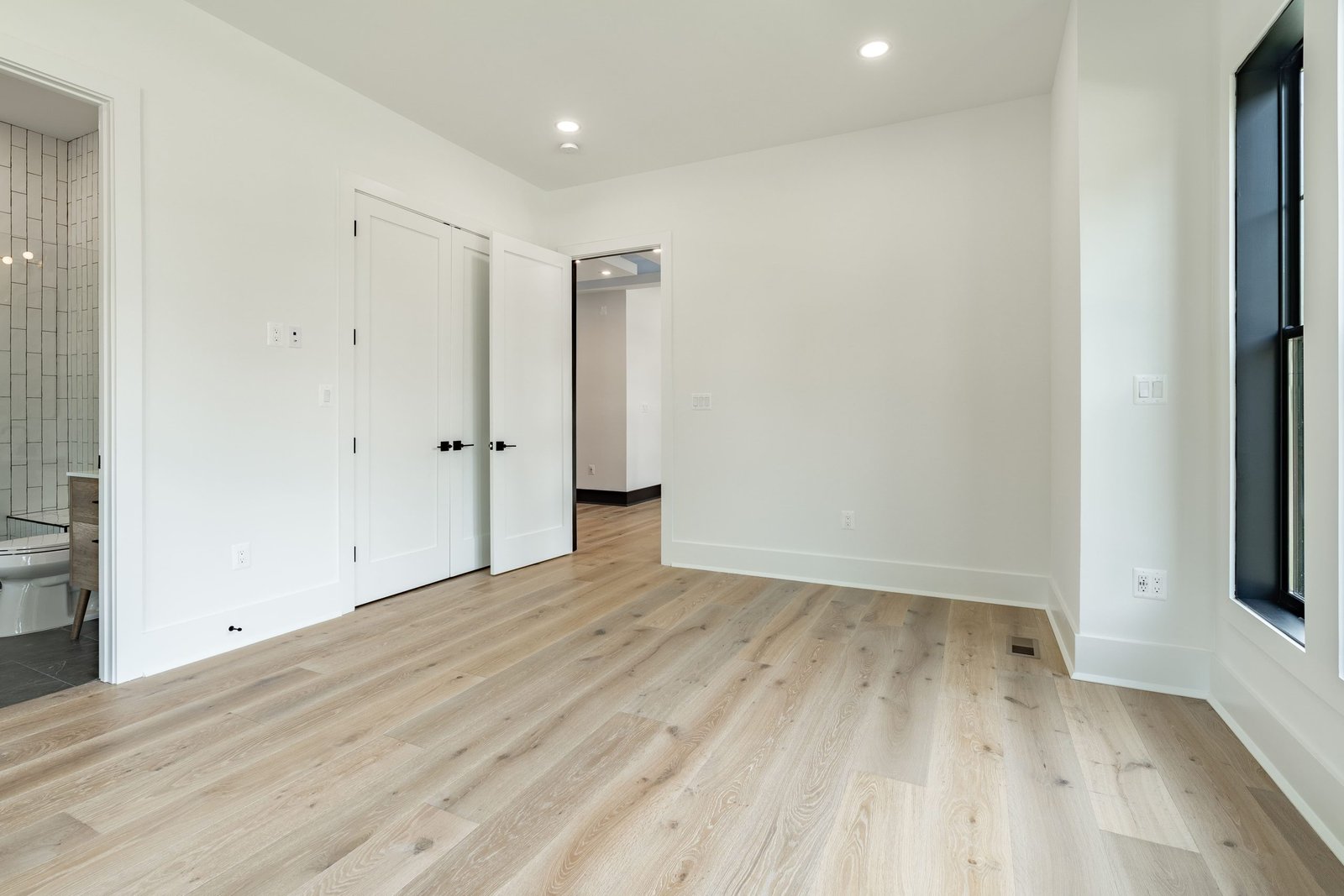 Custom Bedroom Design with Light Wood Flooring