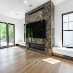 Living Room Remodel with Built-in Fireplace, Benches and TV Mount with Outdoor Porch Access